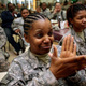 U.S. Army Staff Sgt. Beverlee Burton of Cleveland (left, foreground) cries as she and Capt. Adhana McCarthy watch Barack Obama be sworn in as the 44th president of the United States on Jan. 20, 2009, in the dining hall of Forward Operating Base Kalsu, south of Baghdad.
CHRIS HONDROS/GETTY IMAGES